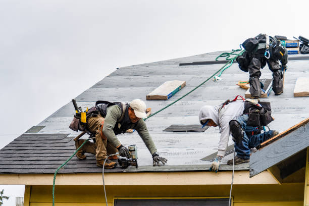 Professional Gutter Installation technician working in Ashland, OR